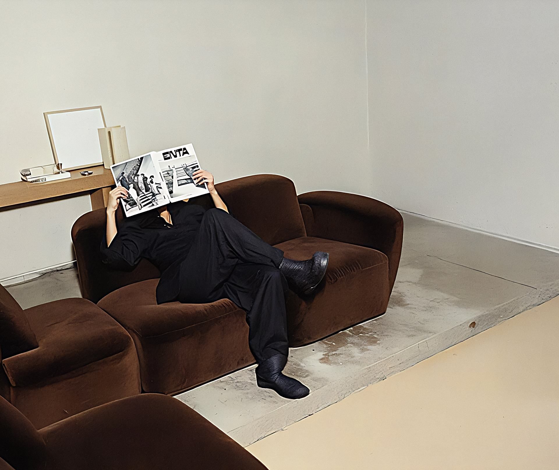Striped green and white lounge chair casting shadows near the edge of a swimming pool with clear blue water.